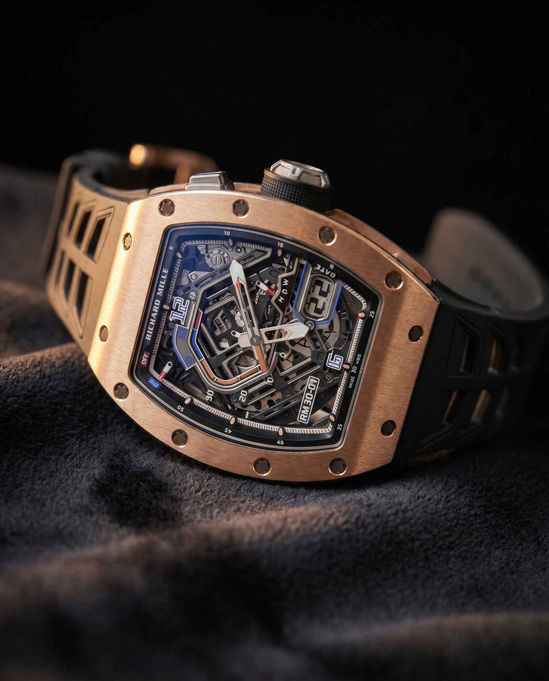 Rose gold Richard Mille skeleton watch on dark fabric, luxury watch valuation